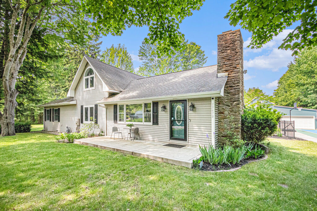 Modern suburban house with stone chimney