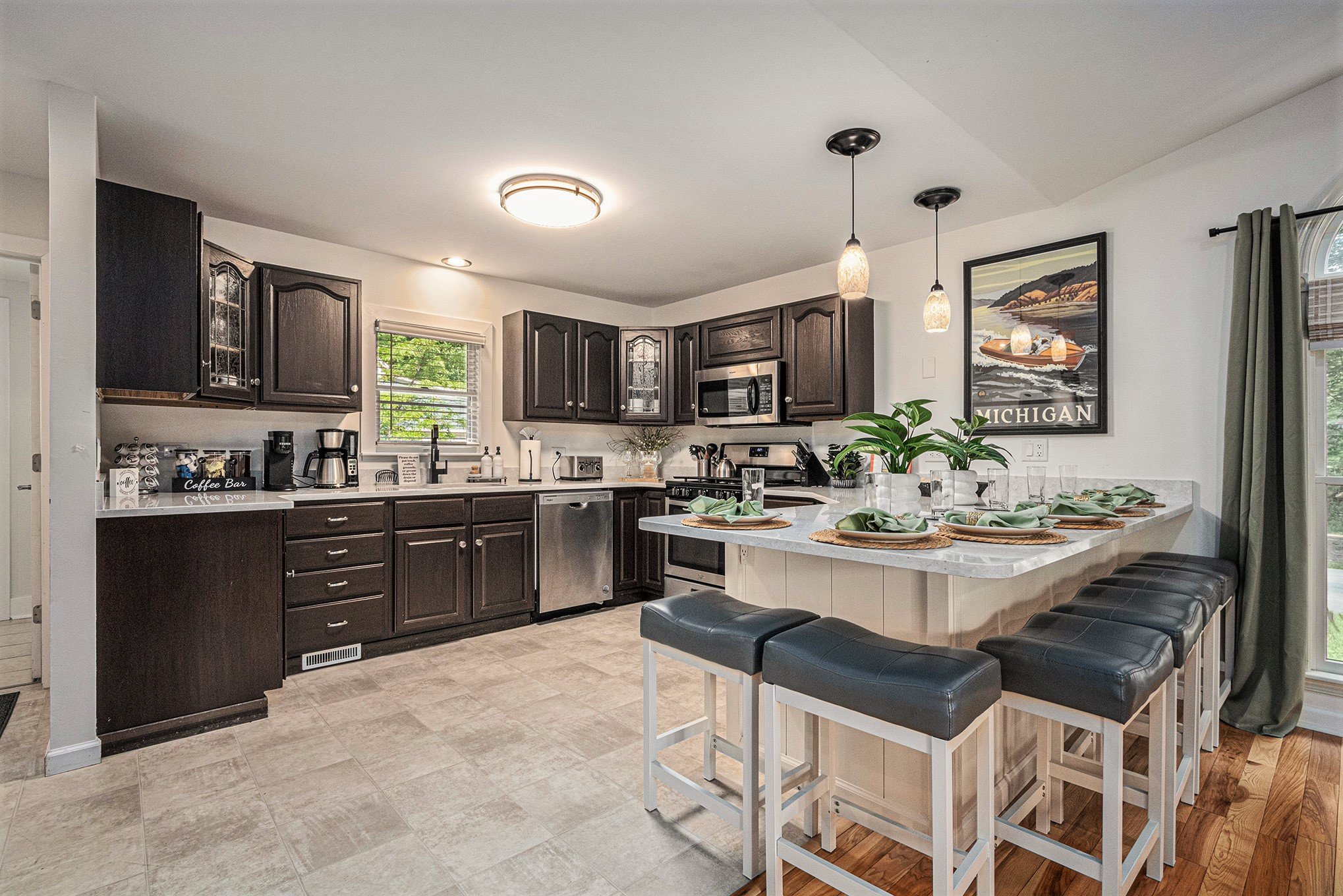 Modern kitchen with dark cabinets and breakfast bar