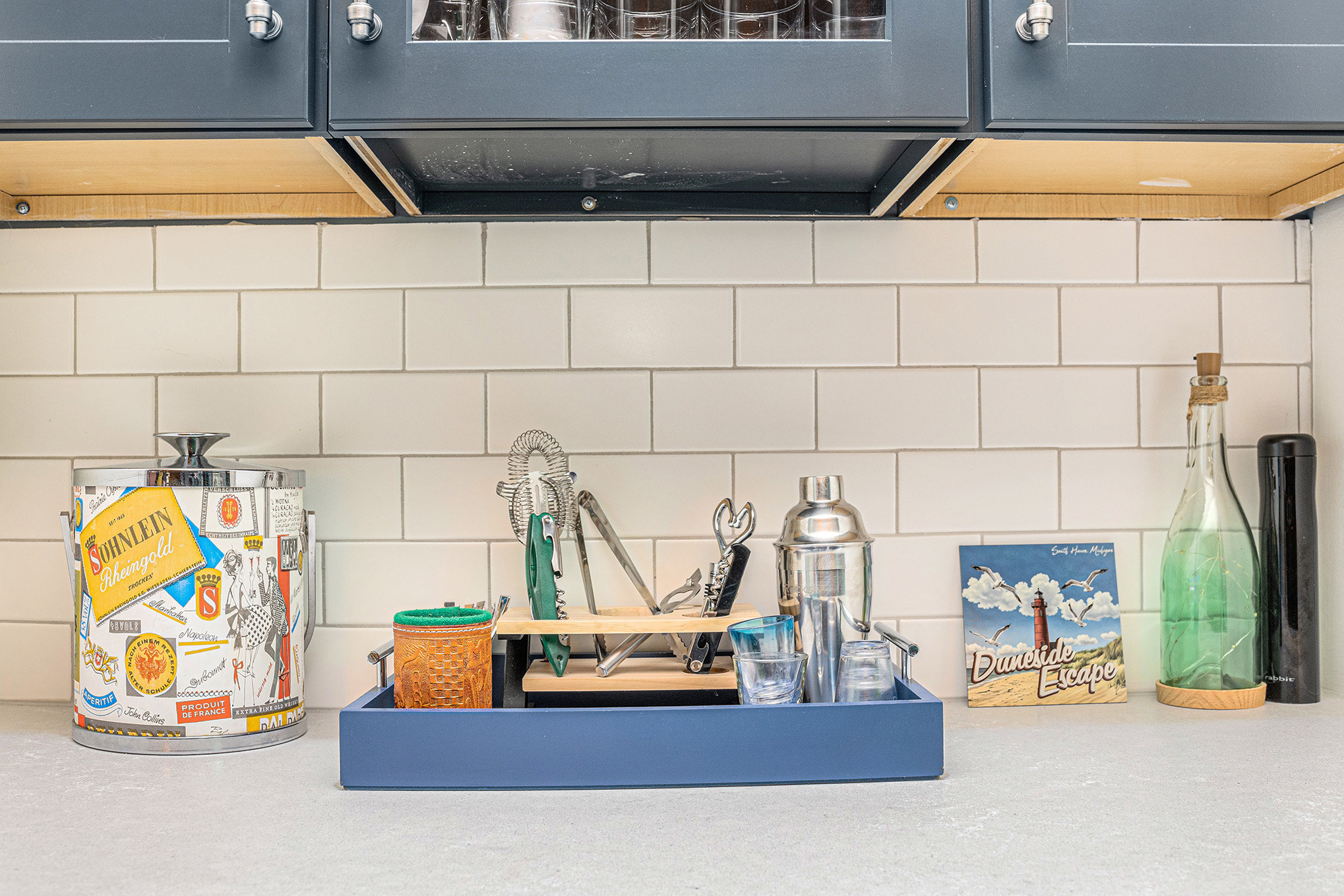 Home bar setup with cocktail tools and bottles