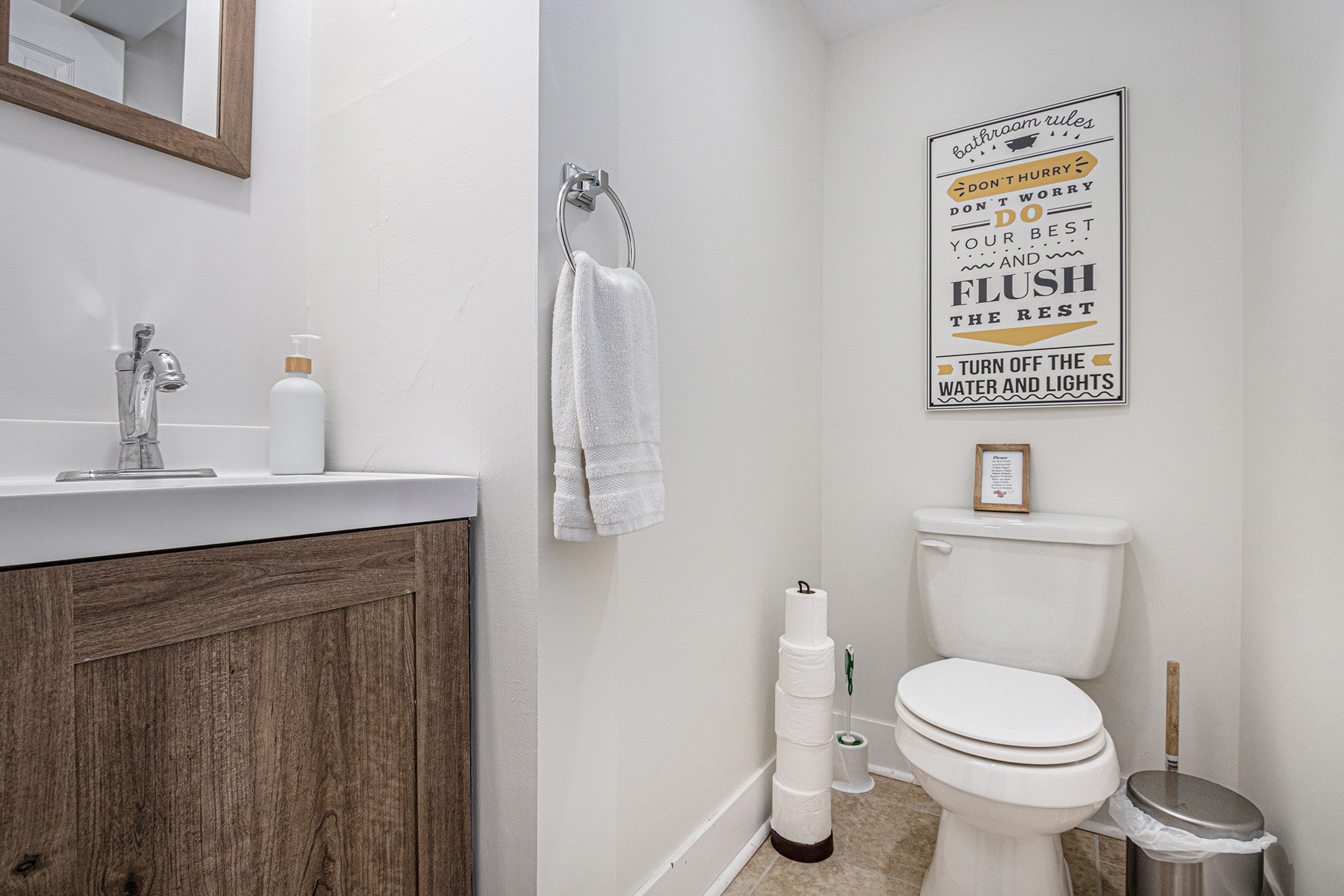 Modern bathroom with toilet and sink.