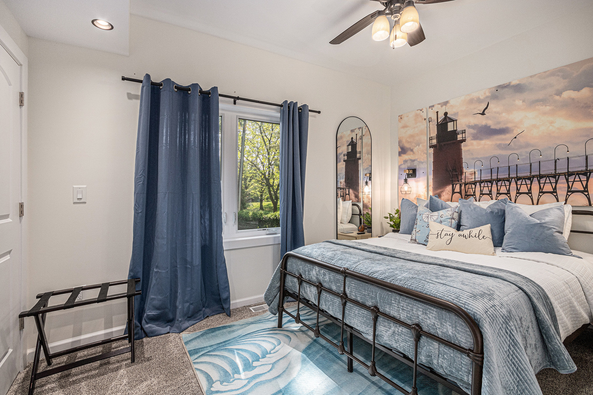 Cozy bedroom with lighthouse wall art