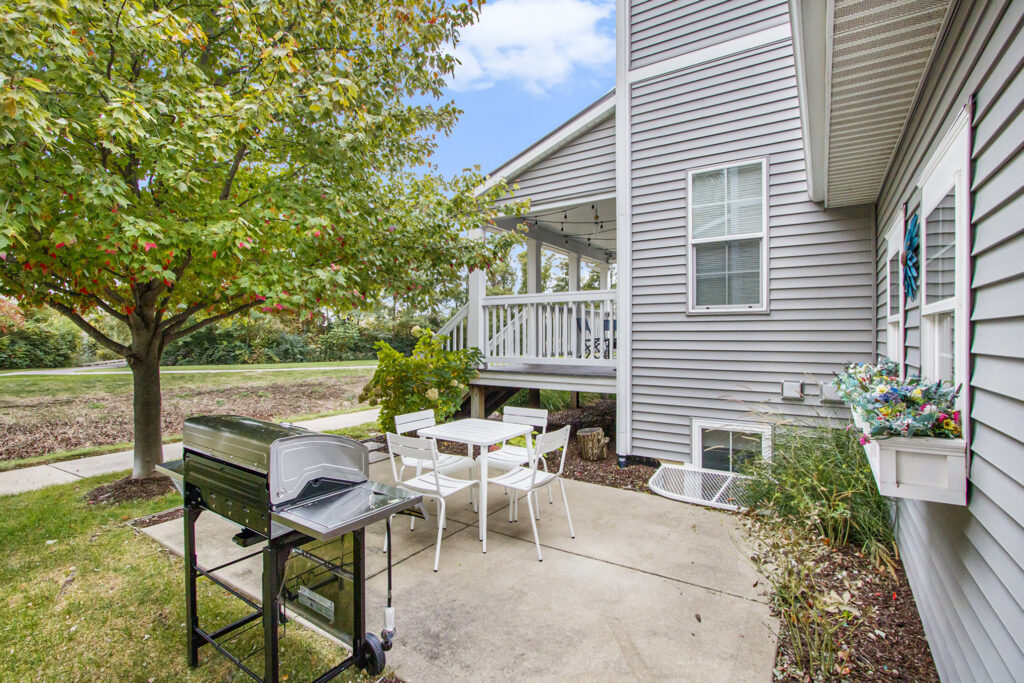 Backyard patio with grill and outdoor seating