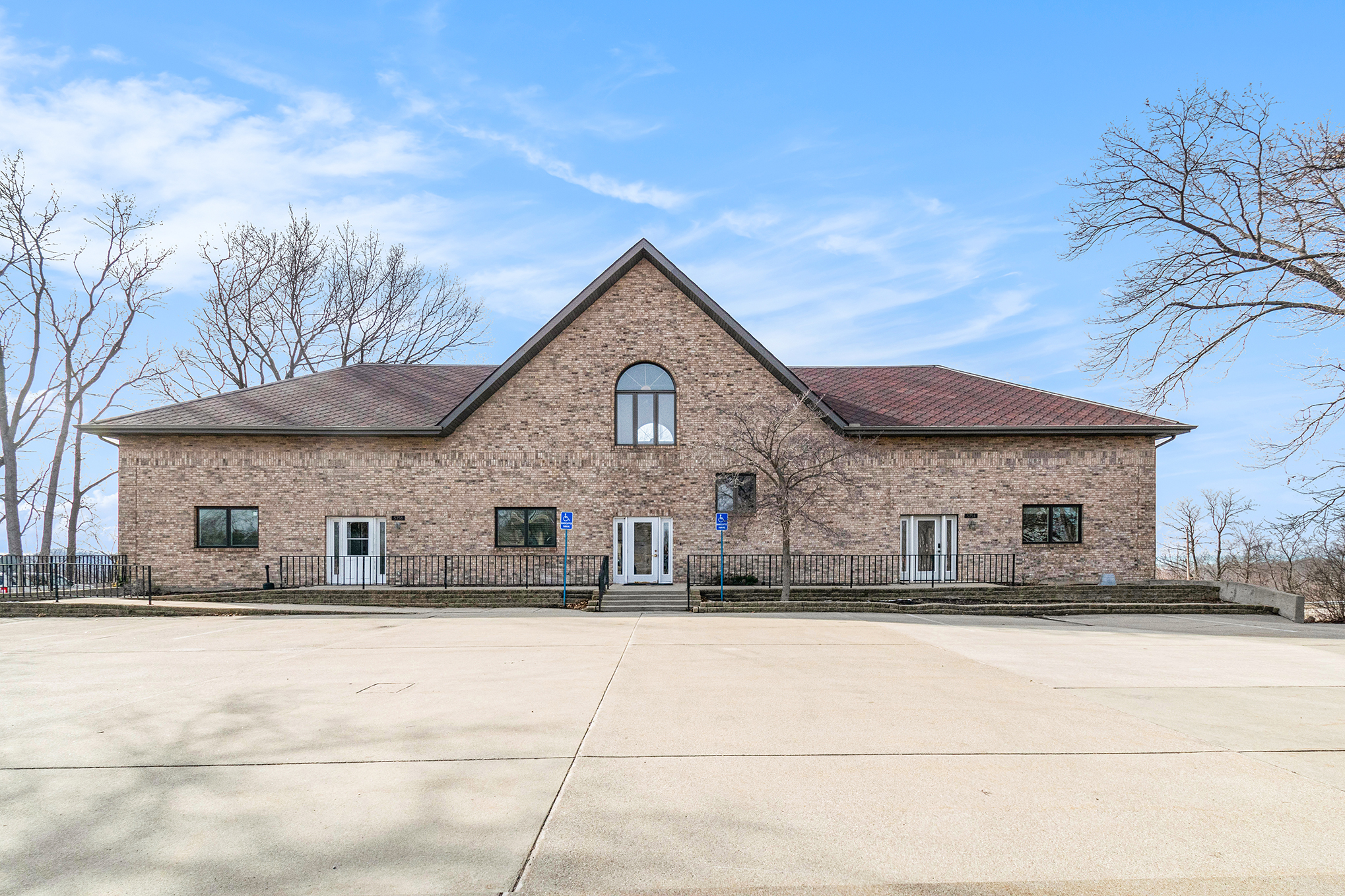 Brick building with parking lot and blue sky