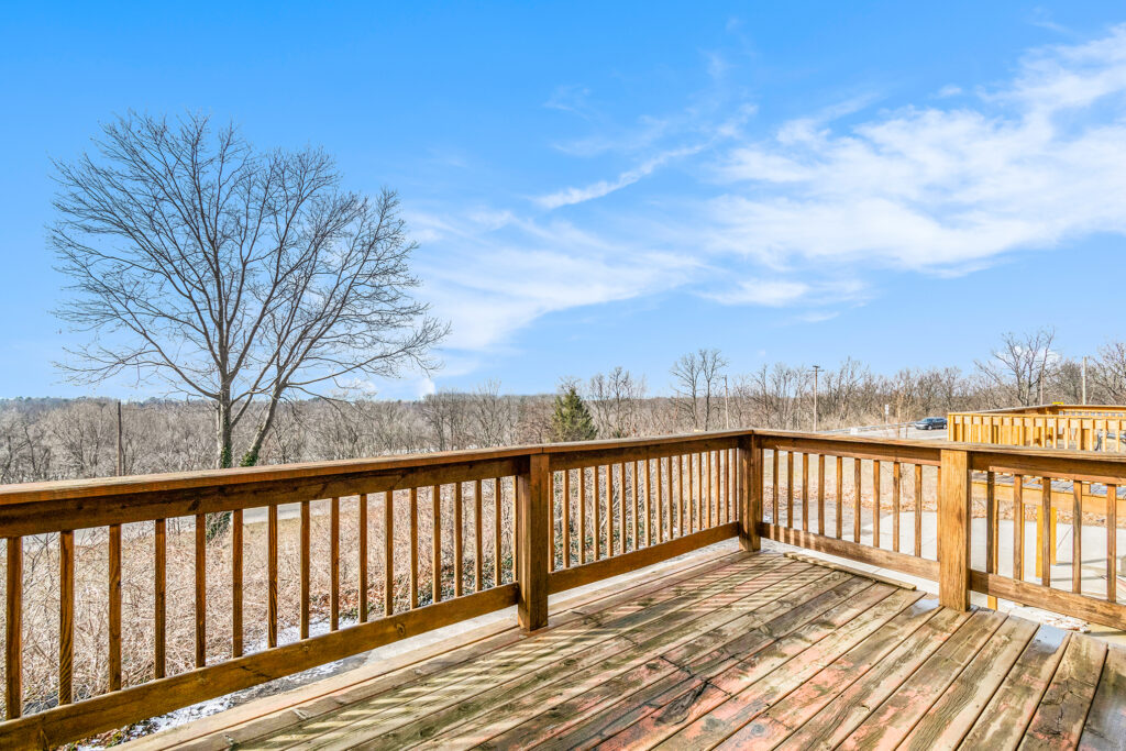 Wooden deck overlooking scenic countryside view