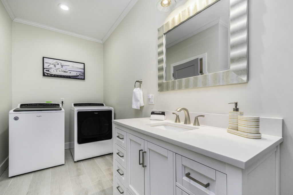 Modern laundry room with washer, dryer, and sink