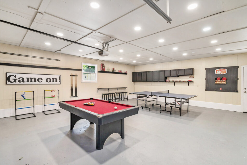 Spacious game room with pool and ping pong tables