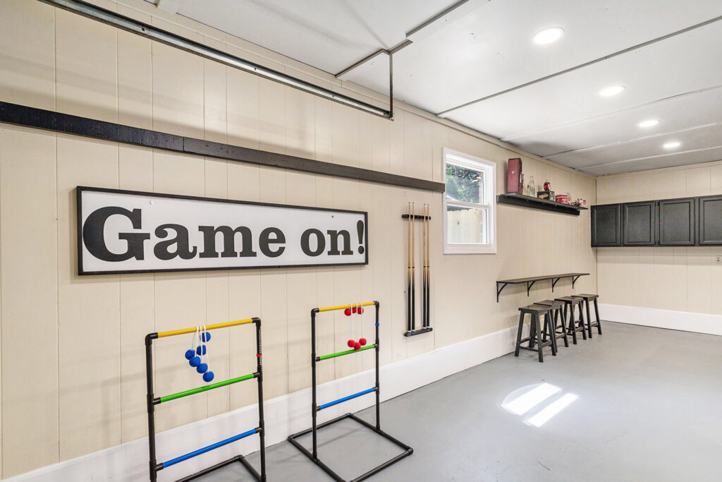 Recreation room with games and bar stools
