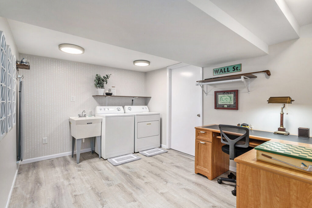 Laundry room with washer, dryer, and desk area