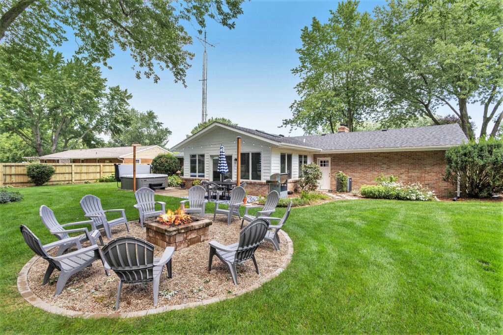 Backyard patio with fire pit and seating