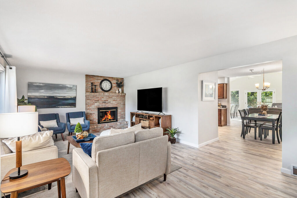 Modern living room with fireplace and dining area