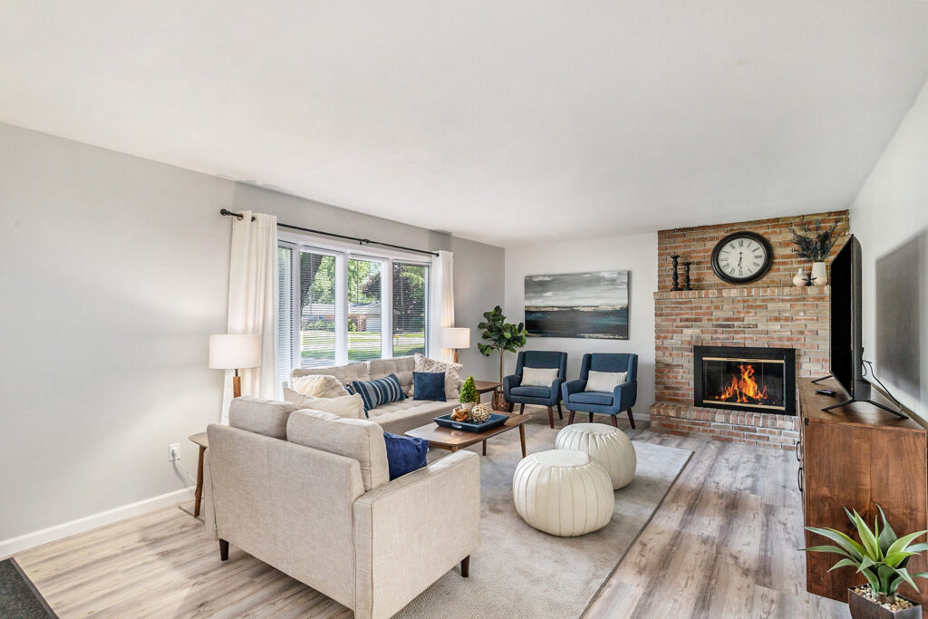 Modern living room with fireplace and large windows