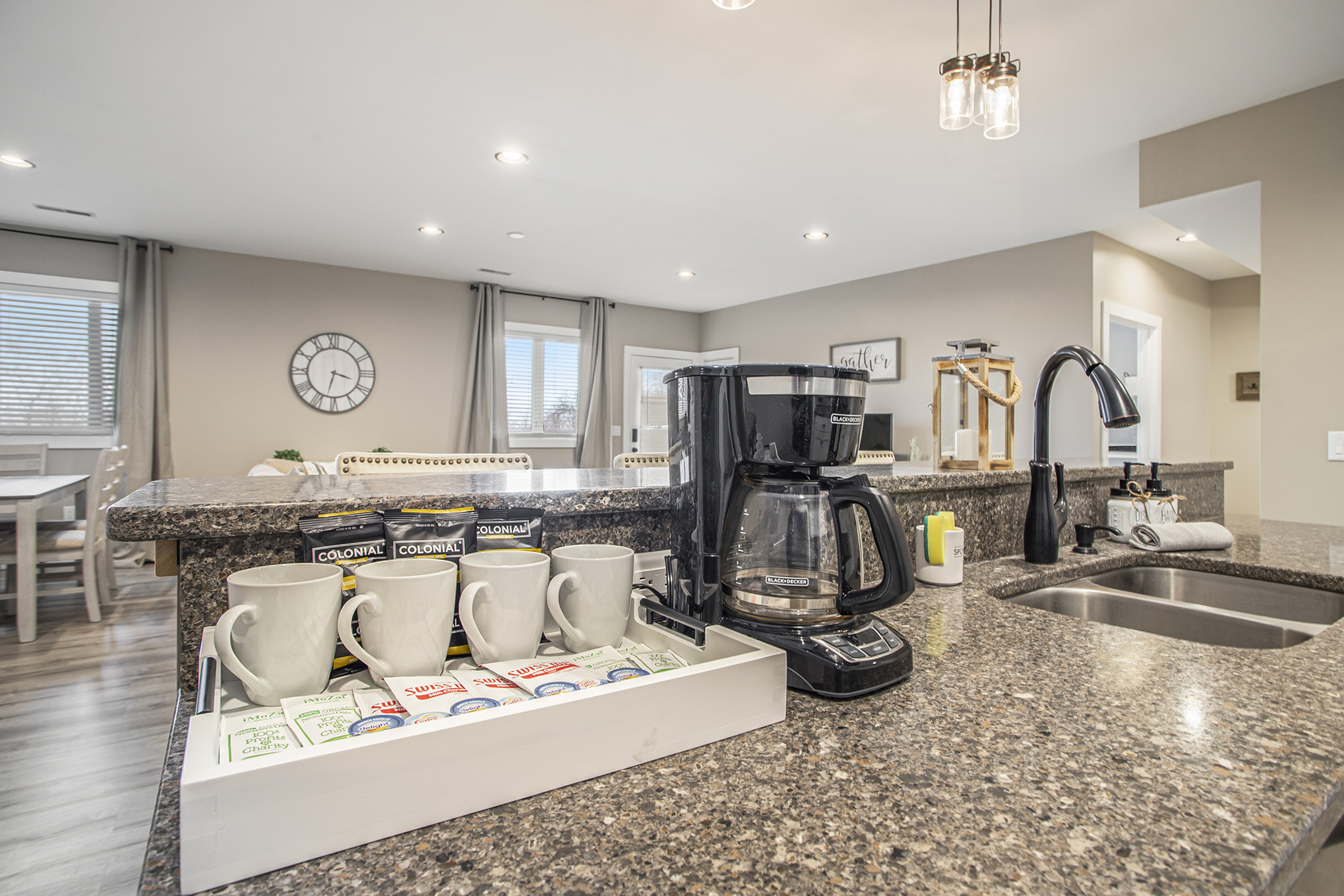 Modern kitchen with coffee maker and mugs