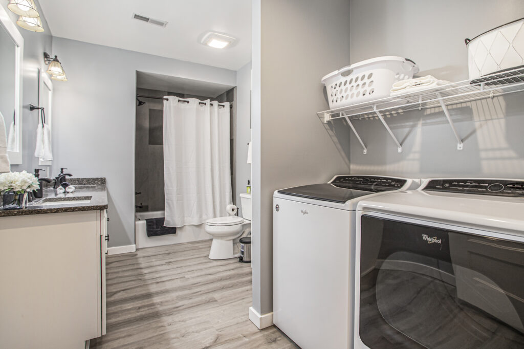 Modern bathroom and laundry room combination space