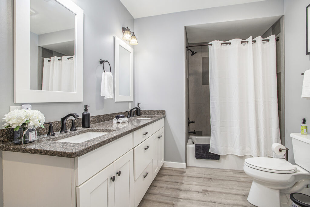 Modern bathroom with double sink and bathtub