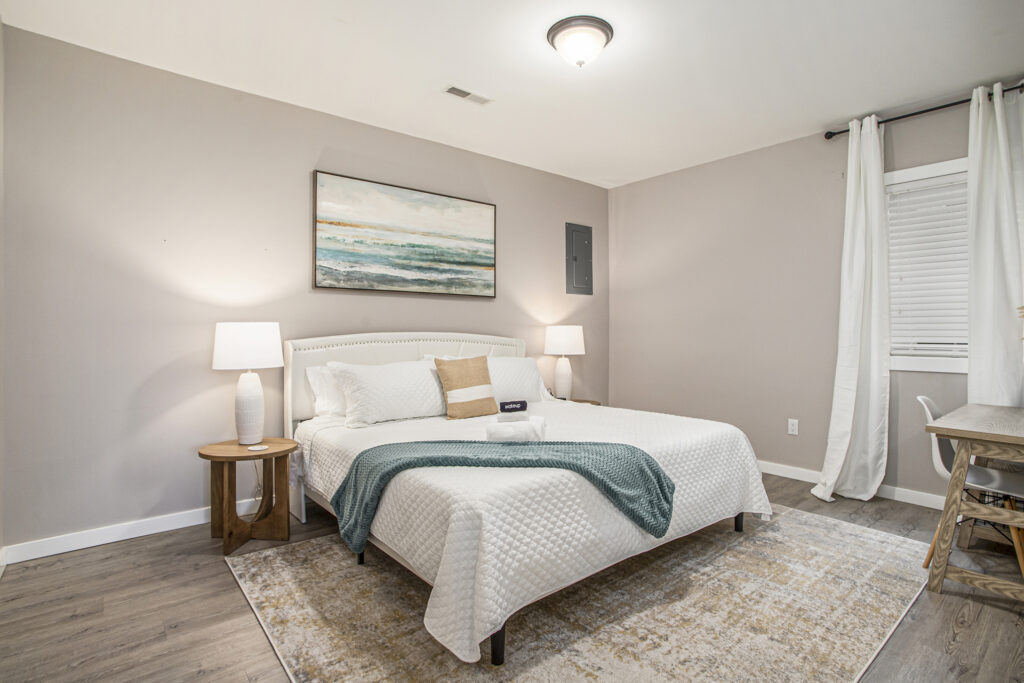 Modern bedroom with queen bed and neutral decor