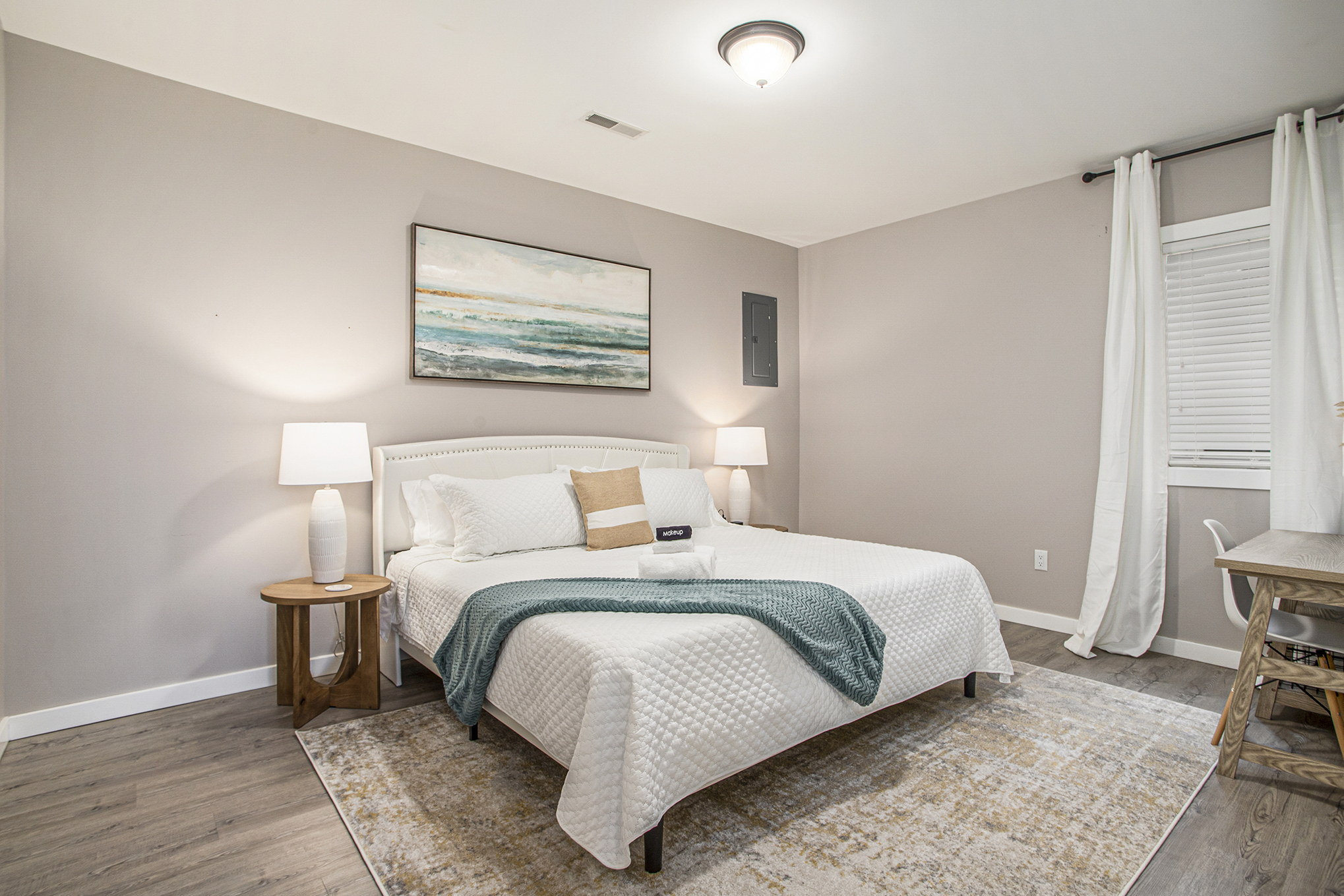 Modern bedroom with queen bed and neutral decor