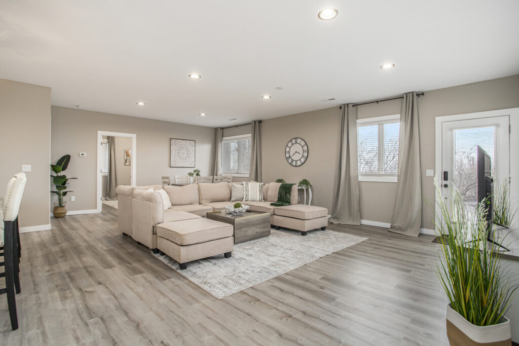 Modern living room with beige sectional sofa