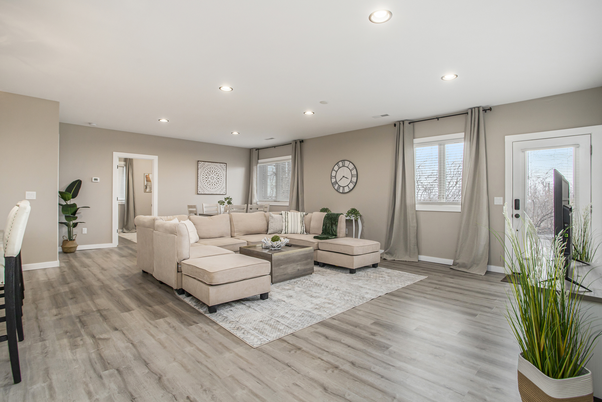 Modern living room with beige sectional sofa