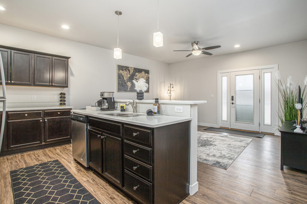 Modern kitchen with dark cabinets and island