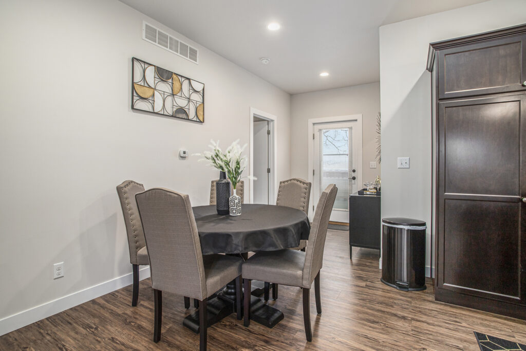 Modern dining area with round table and chairs