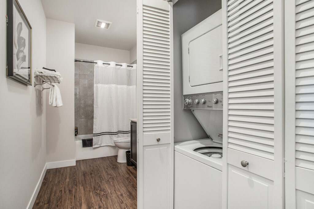 Bathroom with stacked washer and dryer unit