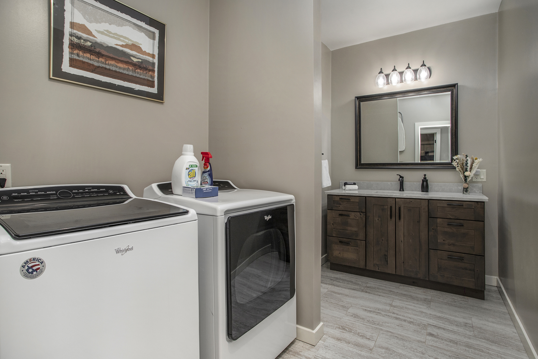 Modern laundry room with sink and washer dryer