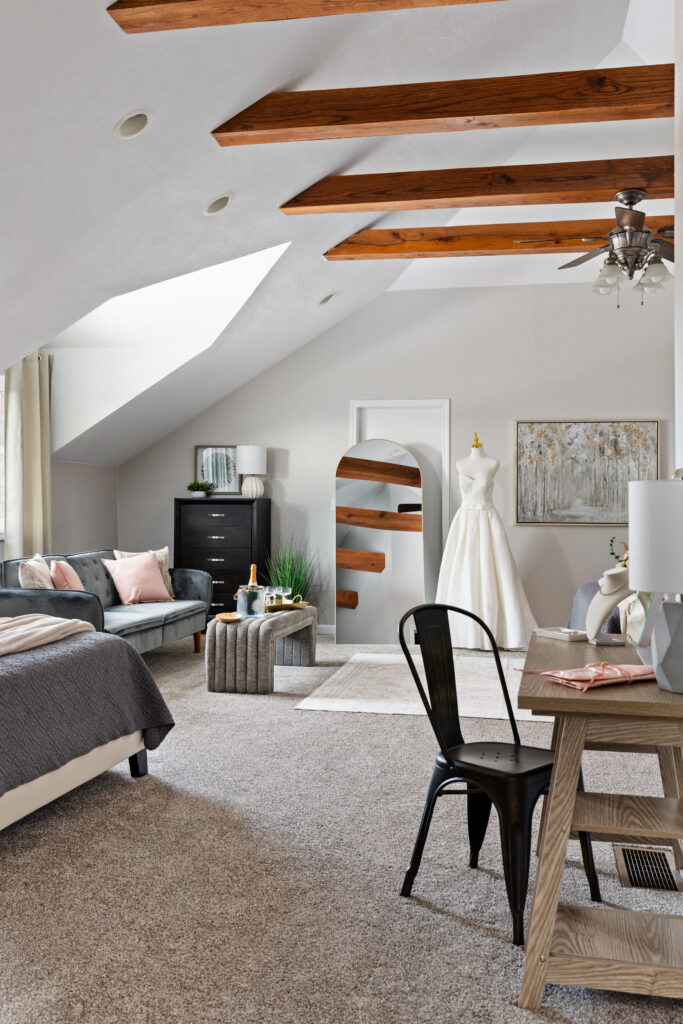 Modern attic bedroom with wooden ceiling beams