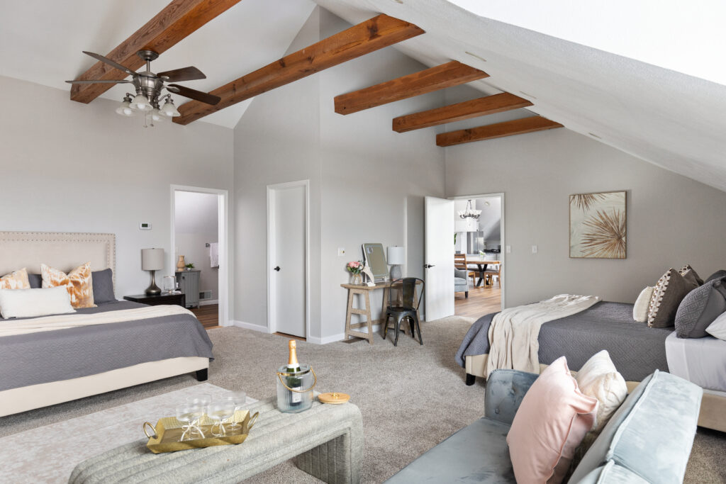 Spacious bedroom with exposed wooden beams