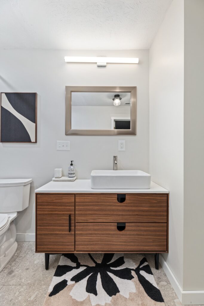 Modern bathroom with wood vanity and vessel sink