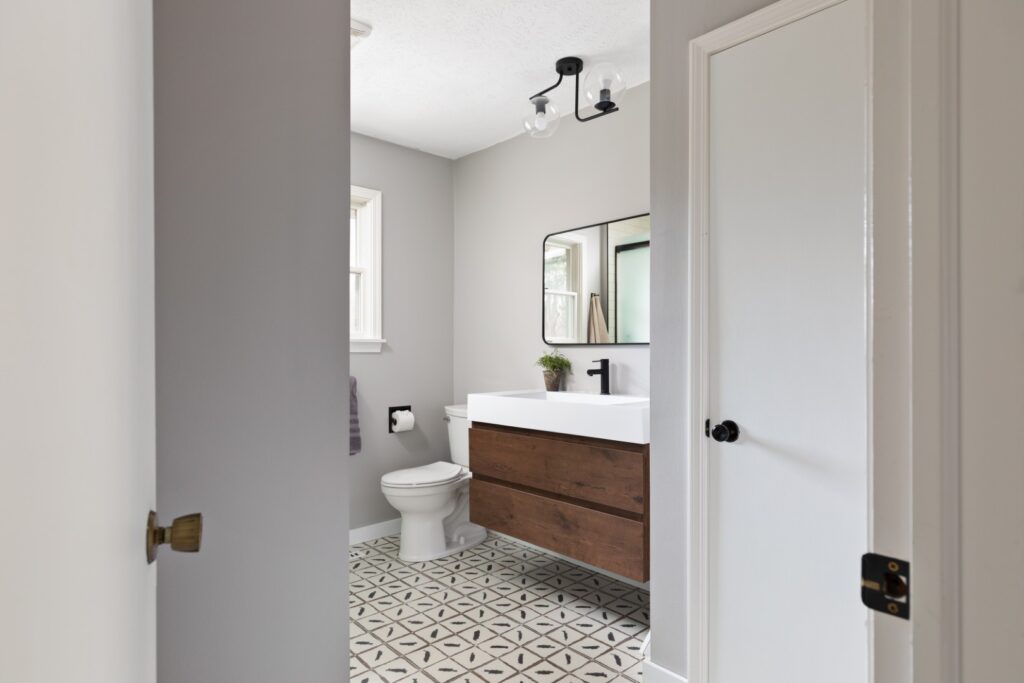 Modern bathroom with vanity and geometric tile floor