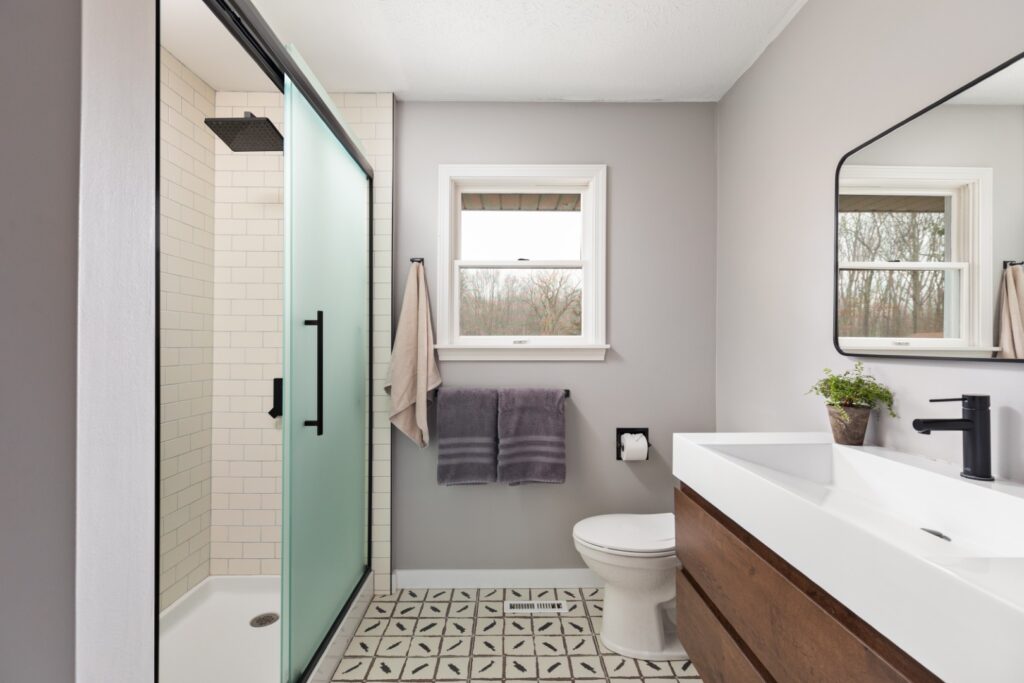 Modern bathroom with shower and wooden vanity