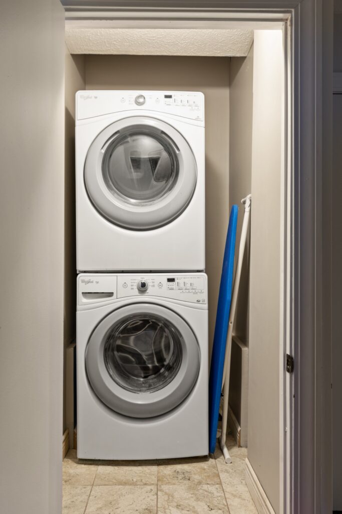 Stacked washer and dryer in small laundry closet