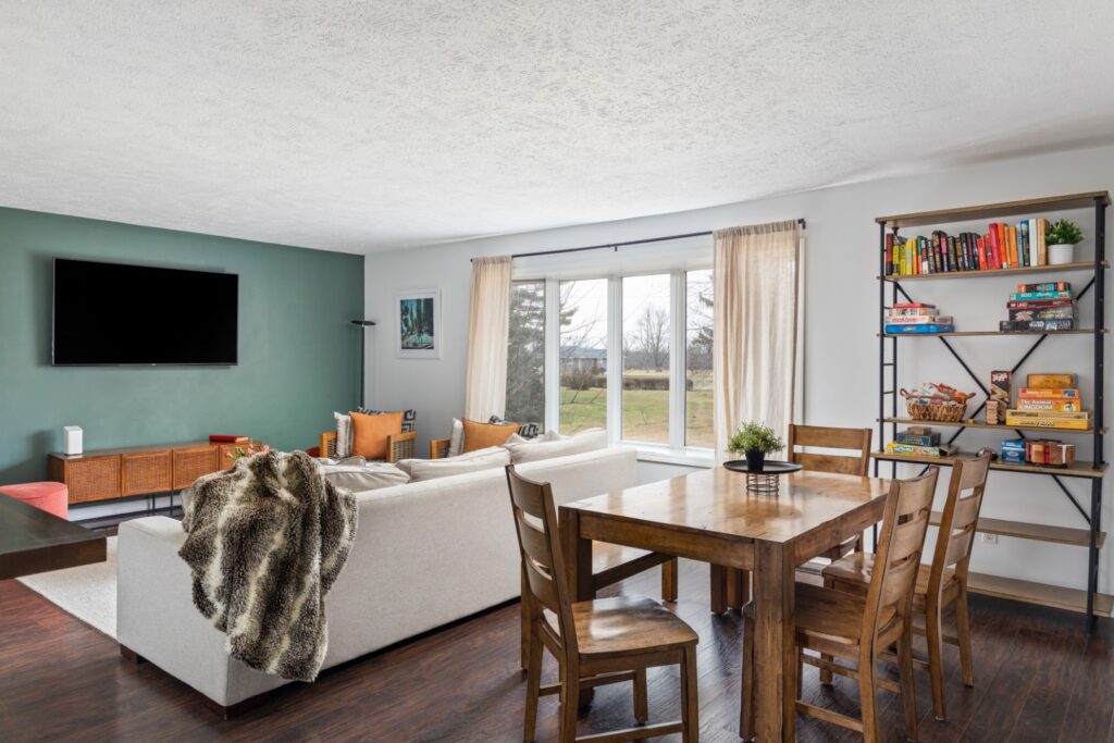 Cozy living room with dining area and bookshelf