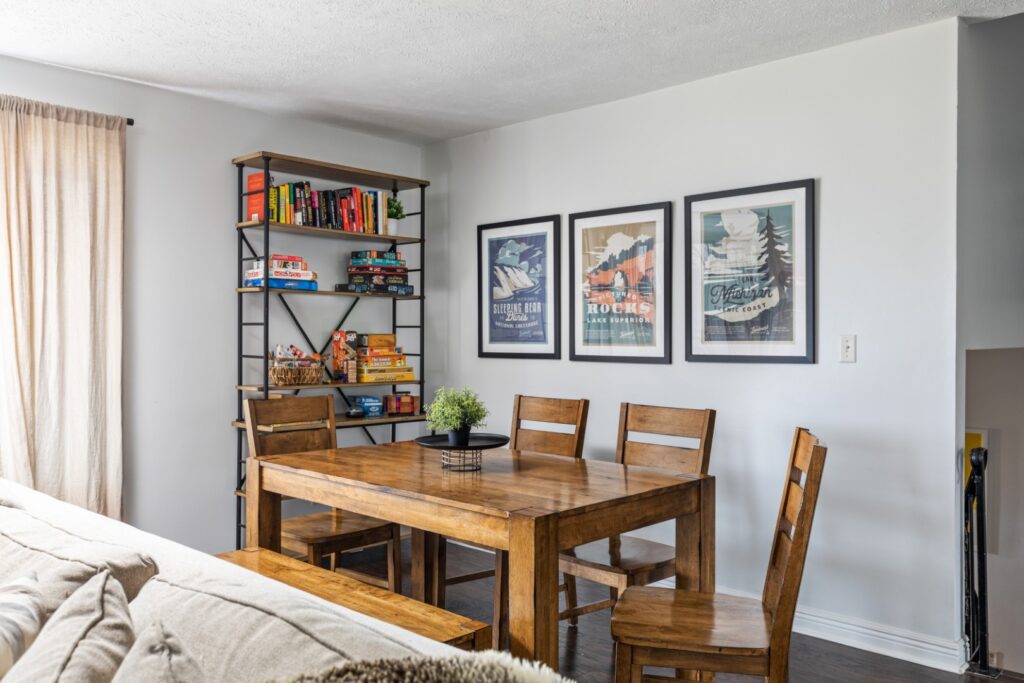 Dining area with wooden table and bookshelf