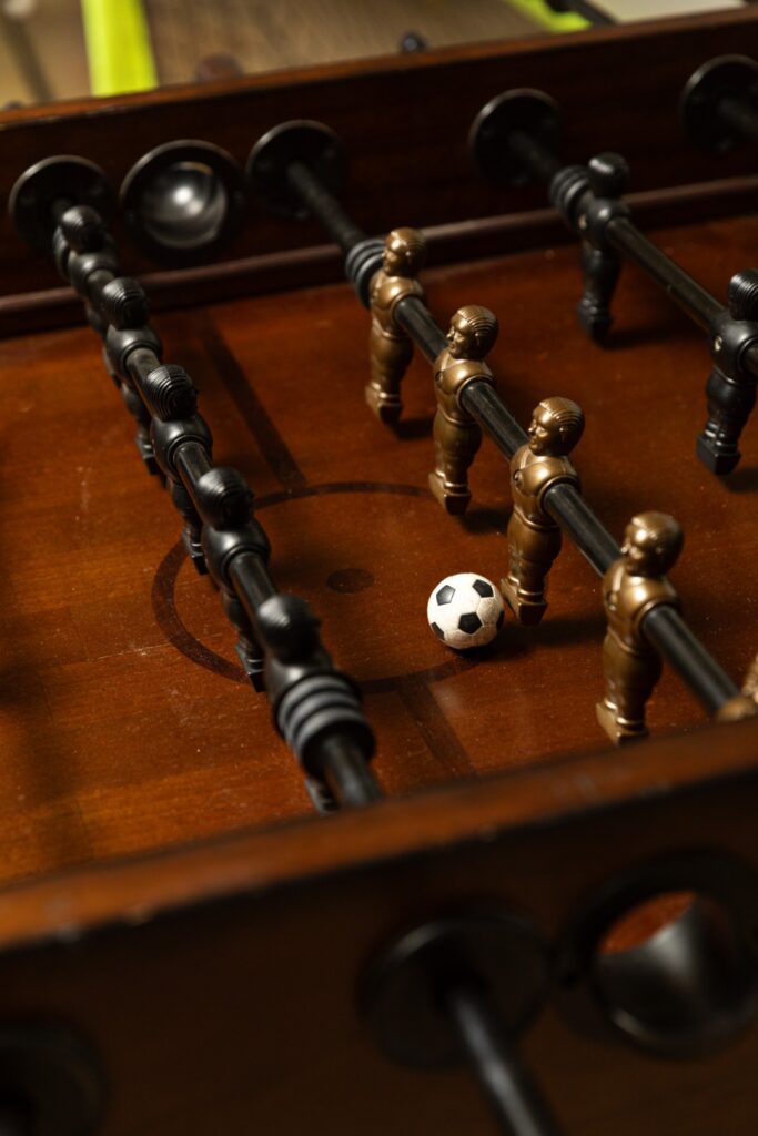 Foosball table with ball and player figures