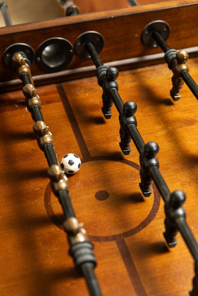 Foosball table with ball near center circle