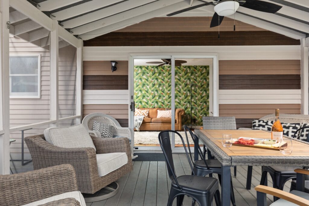 Cozy screened porch with outdoor seating and table