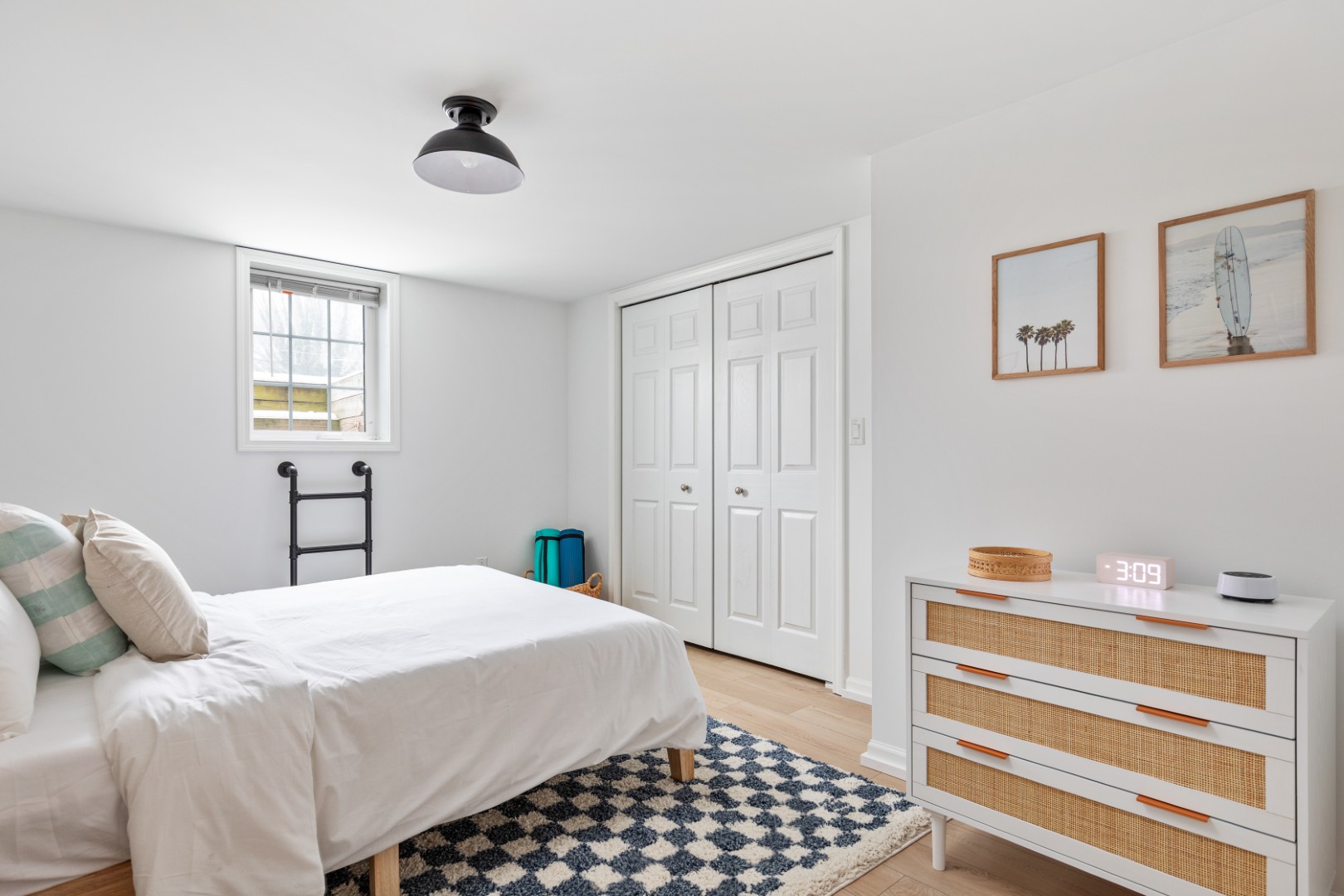 Bright minimalist bedroom with white decor