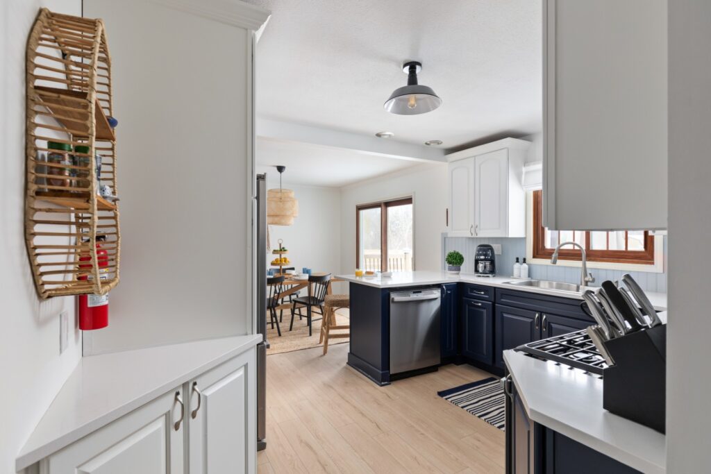 Modern kitchen with navy cabinets and dining area