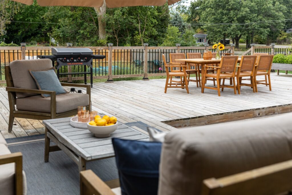 Outdoor patio with seating and grill