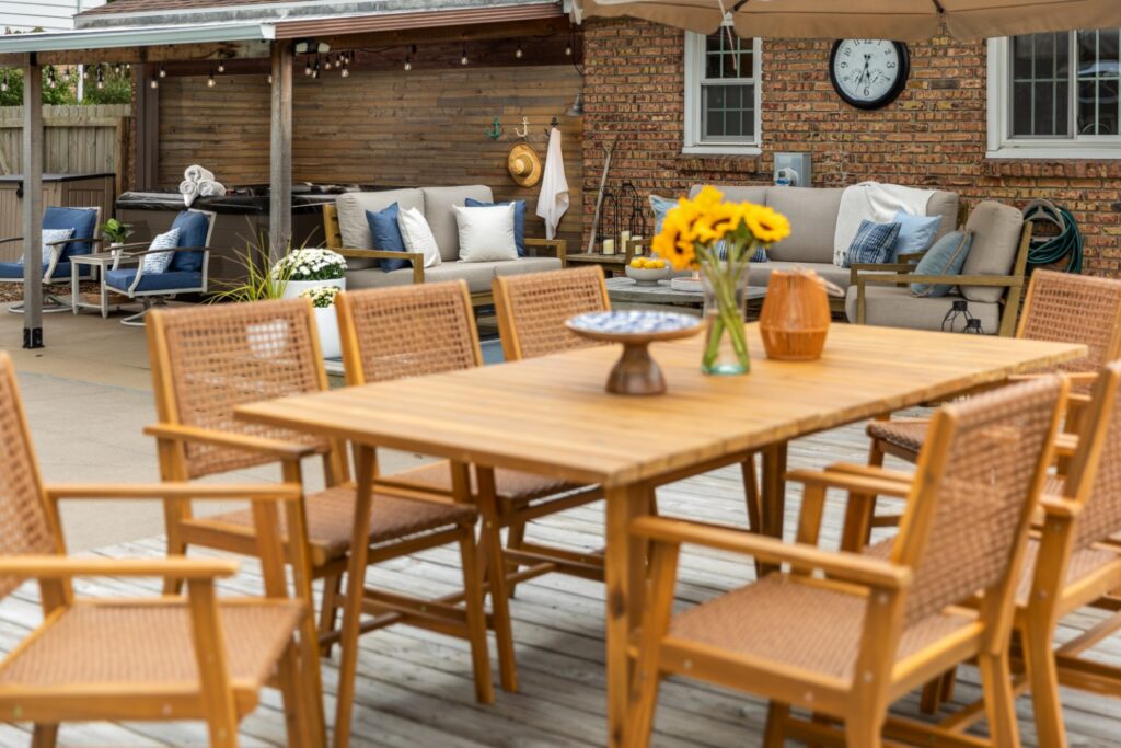 Outdoor patio with wooden furniture and sunflowers