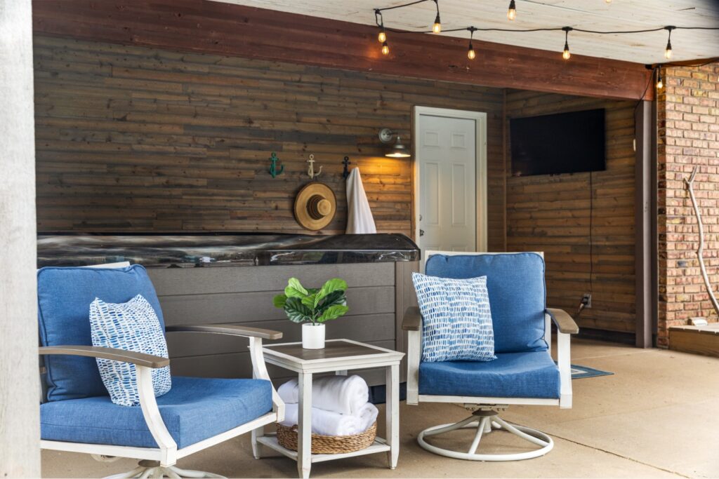 Cozy patio with chairs and hot tub