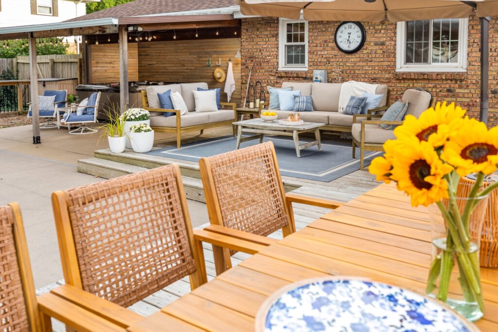 Cozy backyard patio with outdoor seating and sunflowers