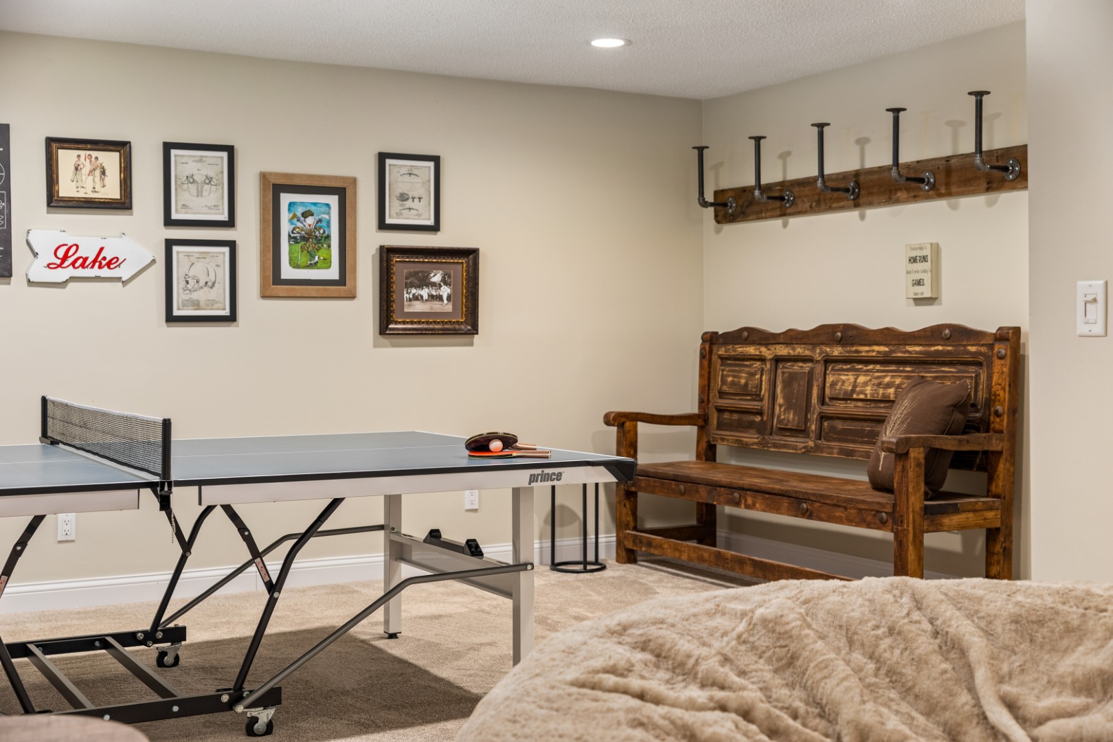 Game room with ping pong table and bench