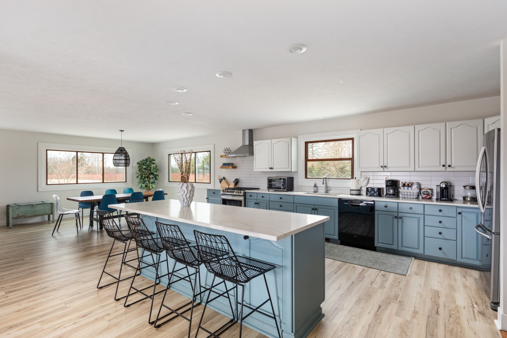 Modern kitchen with blue cabinets and island