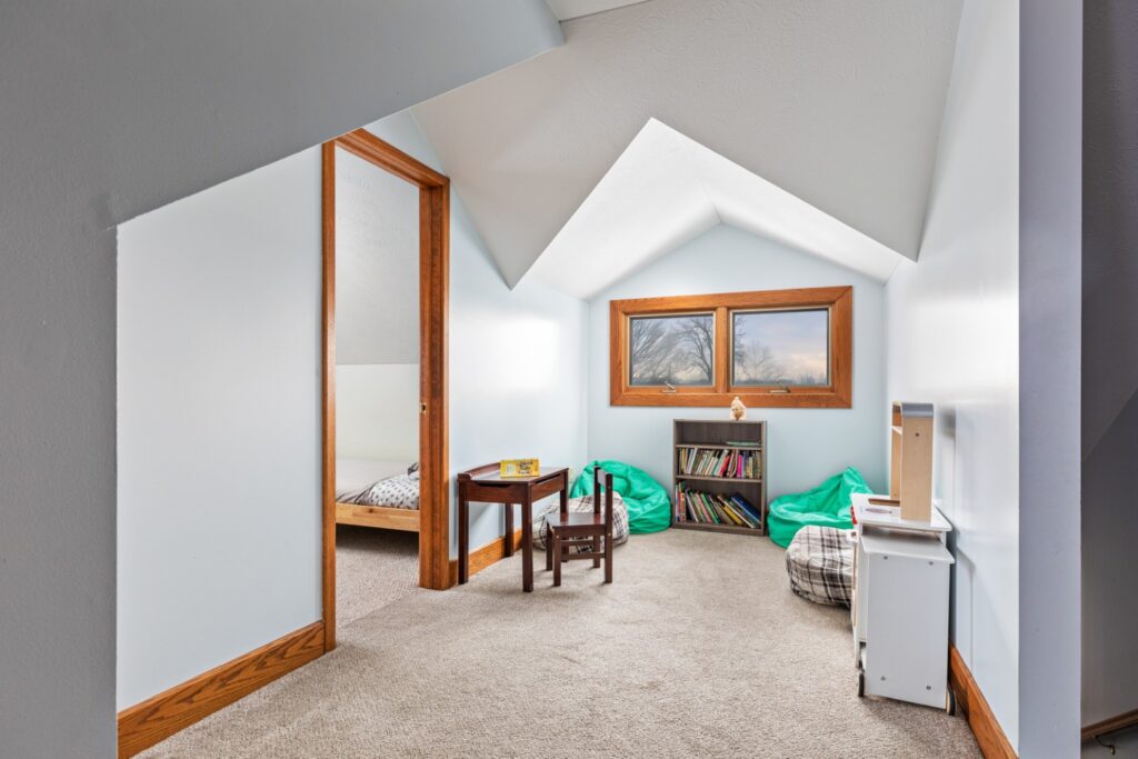 Cozy attic playroom with books and beanbags