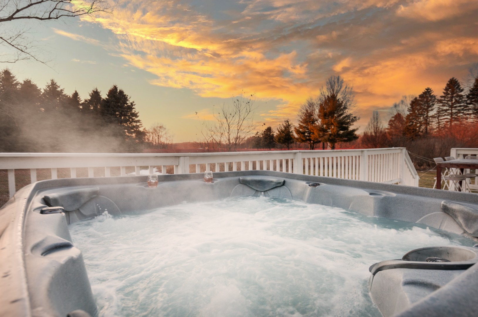 Outdoor hot tub with sunset view