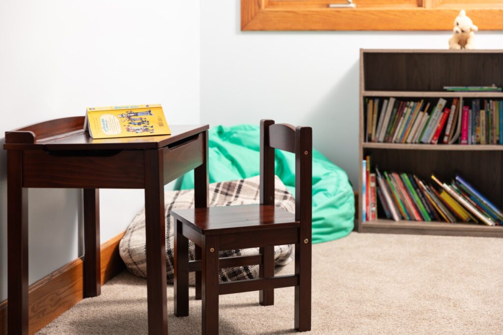 Children's reading corner with desk and bookshelf