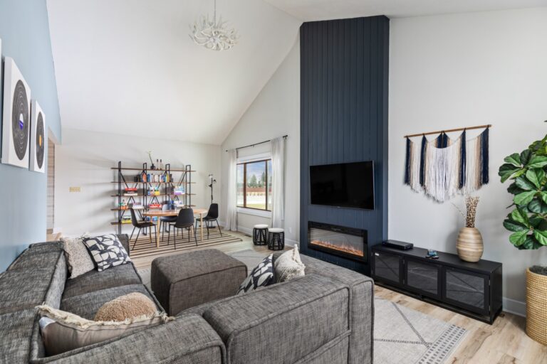 Modern living room with gray sofa and fireplace