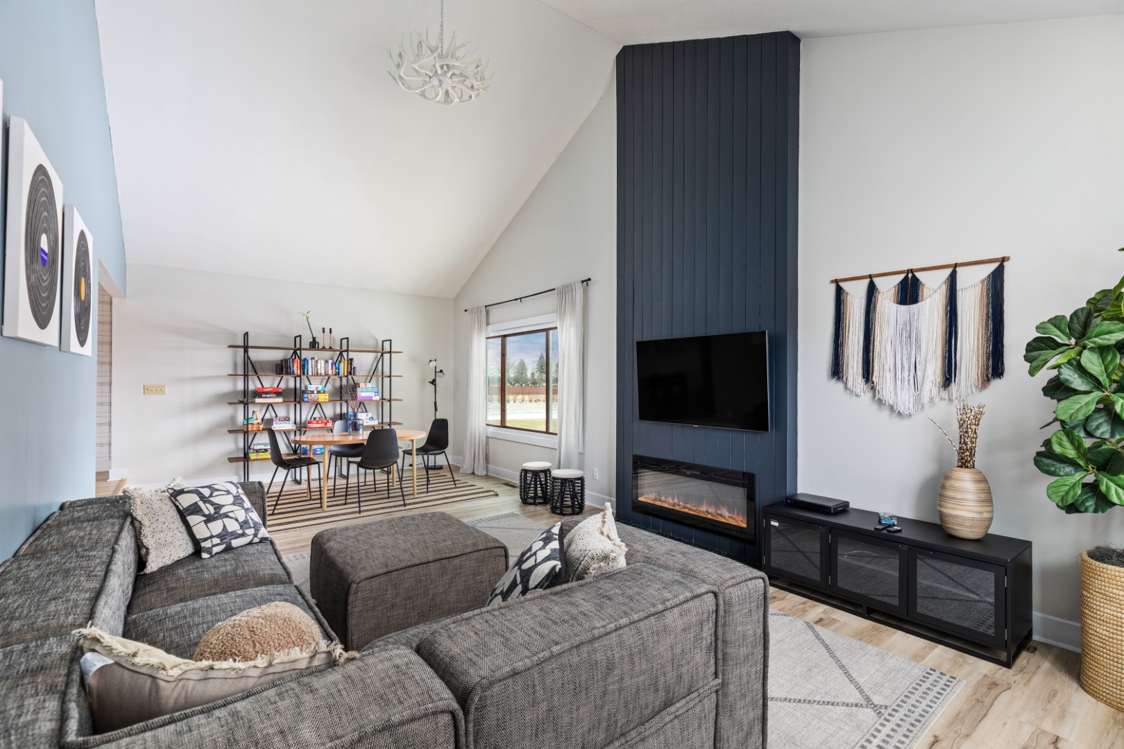 Modern living room with gray sofa and fireplace